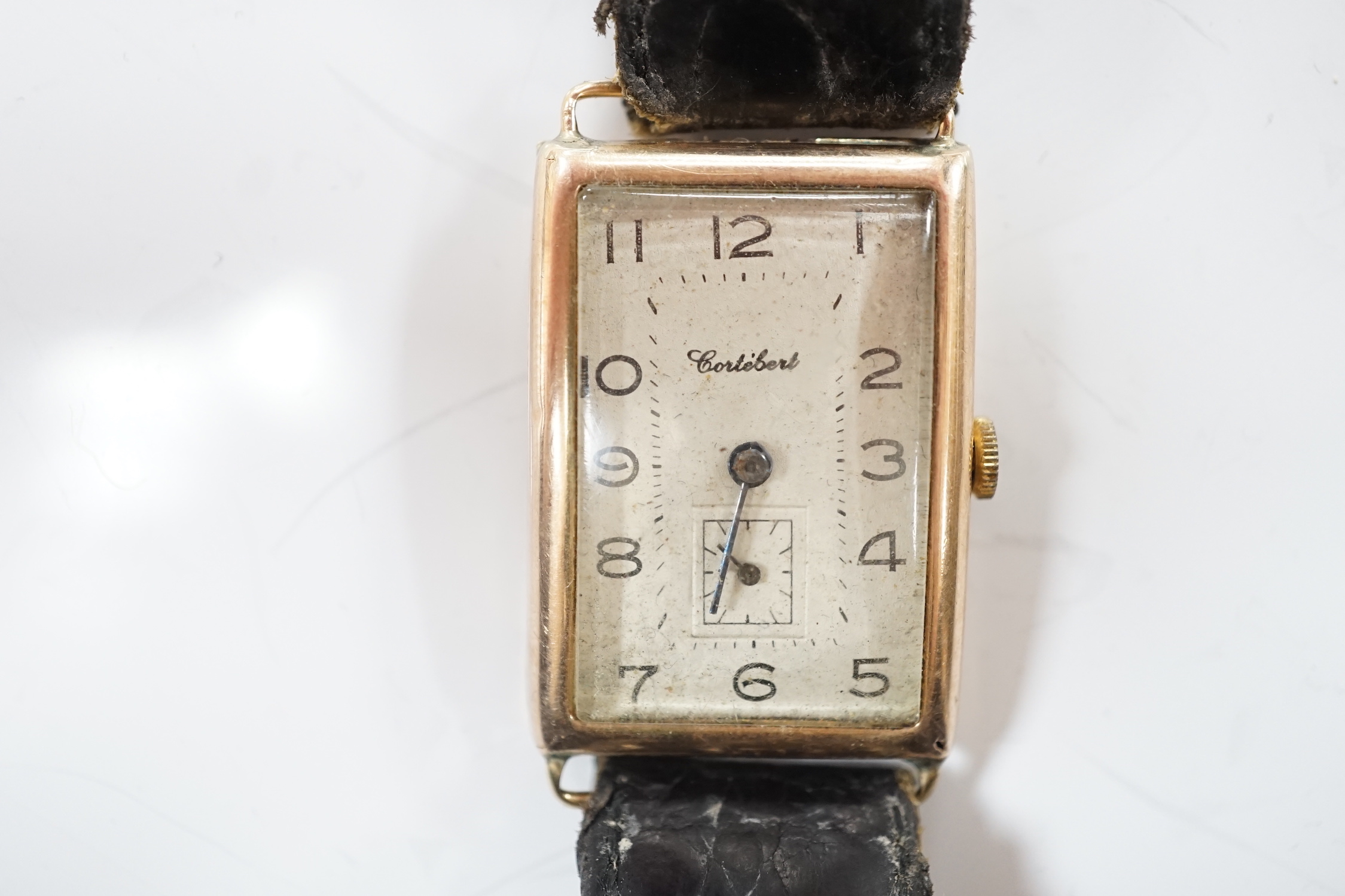A gentleman's 1930's 9ct gold Cortebert manual wind rectangular dial wrist watch, on a leather strap.